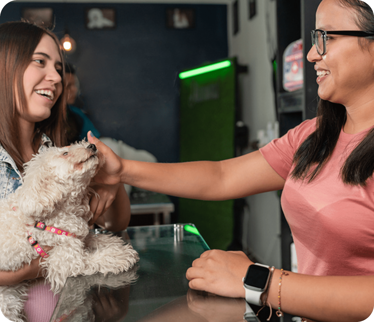 Two women enjoying time with dog